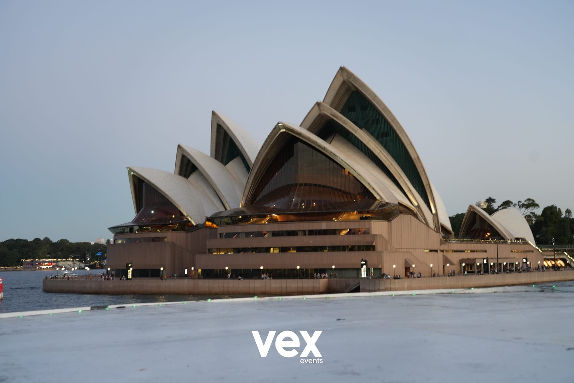 The Sydney Opera House seen from the water at dusk